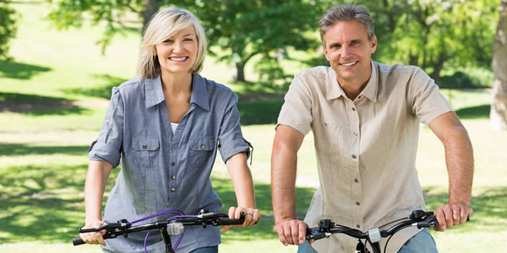 Couple riding bicycles.