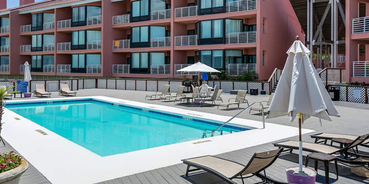 Pool and deck at Palm Beach Club Condominiums overlooking Pensacola Bay